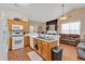 Open kitchen flows into the living room with wood cabinets and stainless sink at 1078 Camry Cir, Dallas, GA 30157