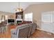 Cozy living room with hardwood floors, fireplace, and comfortable seating arrangement at 1078 Camry Cir, Dallas, GA 30157
