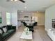 Inviting open floor plan featuring a living area and eat-in kitchen with modern stainless appliances at 115 Deer Xing, Temple, GA 30179