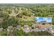 Beautiful aerial view of the home in a lush neighborhood, close to a golf course, and surrounded by trees at 124 Grand Oaks Dr, Canton, GA 30115