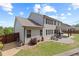 Landscaped backyard featuring a paver patio, lush lawn and privacy fence at 124 Grand Oaks Dr, Canton, GA 30115