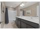 Bathroom with double sink vanity, solid surface countertop, tile floors and shower/tub combo at 124 Grand Oaks Dr, Canton, GA 30115
