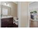 Bathroom featuring a vanity with dark wood, sink, and an adjacent dining area at 124 Grand Oaks Dr, Canton, GA 30115