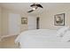 Bright bedroom with plush carpet, ceiling fan and two closets at 124 Grand Oaks Dr, Canton, GA 30115