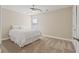 Bright bedroom with plush carpet, neutral paint, ceiling fan and large window at 124 Grand Oaks Dr, Canton, GA 30115