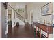 Inviting foyer showcasing hardwood floors, staircase, and a beautiful console table at 124 Grand Oaks Dr, Canton, GA 30115