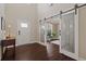 Welcoming foyer features hardwood floors and elegant sliding barn doors leading to another room at 124 Grand Oaks Dr, Canton, GA 30115