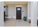 Inviting front porch featuring a stylish door with a transom window and comfortable seating at 124 Grand Oaks Dr, Canton, GA 30115