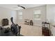 Spacious gym featuring a ceiling fan, plush carpet and large windows overlooking the yard at 124 Grand Oaks Dr, Canton, GA 30115