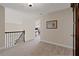 Cozy hallway with neutral carpet and trim, leading to various rooms on the upper floor at 124 Grand Oaks Dr, Canton, GA 30115