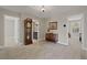 Neutral hallway with doorways leading to different rooms, furnished with vintage-style furniture pieces at 124 Grand Oaks Dr, Canton, GA 30115