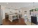 Bright kitchen featuring stainless steel appliances, island with seating, and an adjacent dining area at 124 Grand Oaks Dr, Canton, GA 30115