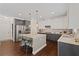 Spacious kitchen with stainless appliances, an island with seating, and hardwood floors at 124 Grand Oaks Dr, Canton, GA 30115