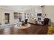 Spacious living room with a stone fireplace, large windows, hardwood floors, and high ceilings at 124 Grand Oaks Dr, Canton, GA 30115