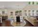 Well-lit living room features hardwood floors, recessed lighting, and several windows at 124 Grand Oaks Dr, Canton, GA 30115