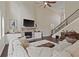 Living room featuring fireplace, hardwood floors, and open floor plan at 124 Grand Oaks Dr, Canton, GA 30115