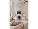 Spacious living room with tall ceilings, a ceiling fan, and beautiful fireplace at 124 Grand Oaks Dr, Canton, GA 30115