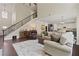 Spacious living room with tall ceilings and dark hardwood floors at 124 Grand Oaks Dr, Canton, GA 30115
