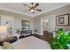 Bright living room with light gray walls, hardwood floors, and lots of plants at 124 Grand Oaks Dr, Canton, GA 30115