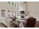 Living room features a floor to ceiling fireplace and high windows for maximum light at 124 Grand Oaks Dr, Canton, GA 30115