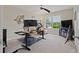Bright office space featuring a standing desk, ceiling fan and large windows, perfect for working from home at 124 Grand Oaks Dr, Canton, GA 30115