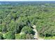 Aerial view of a heavily wooded neighborhood, showcasing the area's natural beauty at 1379 Branchwood Dr, Snellville, GA 30078