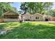 Expansive backyard with lush green lawn, perfect for outdoor activities and relaxation at 1379 Branchwood Dr, Snellville, GA 30078