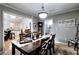 Spacious dining room with seating for six, connecting to the kitchen and other rooms at 1379 Branchwood Dr, Snellville, GA 30078