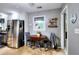 An eat-in breakfast nook is set off the kitchen and features tile flooring and a window to the backyard at 1379 Branchwood Dr, Snellville, GA 30078