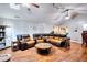 Spacious living room features vaulted ceilings, a large sectional, and attractive wood-look flooring at 1379 Branchwood Dr, Snellville, GA 30078