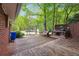 Spacious wooden deck with a built-in grilling area, bench seating, and ample room for outdoor entertaining at 2771 Stonecreek Se Rd, Smyrna, GA 30080