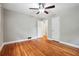 Comfortable bedroom with hardwood floors, ceiling fan, and neutral paint, two door ways at 2771 Stonecreek Se Rd, Smyrna, GA 30080