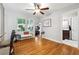 Bright dining area features hardwood floors, a ceiling fan, and a bench by the window for a cozy atmosphere at 2771 Stonecreek Se Rd, Smyrna, GA 30080