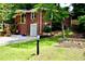 Beautiful home showcasing lush landscaping, a brick facade, and a well-maintained yard at 2771 Stonecreek Se Rd, Smyrna, GA 30080