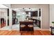Open kitchen view with dark wood cabinetry, granite countertops, and a central island with seating at 2771 Stonecreek Se Rd, Smyrna, GA 30080