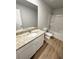 The bathroom has a granite countertop vanity and shower-tub combination at 528 Earnest Ln, Temple, GA 30179