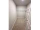 Walk-in closet with carpet flooring and wire shelving at 528 Earnest Ln, Temple, GA 30179