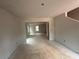 Unfinished new home living room featuring ample natural light, and generous open layout at 25 Yellow Brick Way, Covington, GA 30014