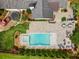 Aerial view showcases a backyard with pool, spa, and patio with dining and lounge areas at 3967 Manson Se Ave, Smyrna, GA 30082