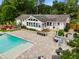 Backyard features a pool, patio, and sunroom for outdoor relaxation and entertaining at 3967 Manson Se Ave, Smyrna, GA 30082