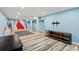 Spacious basement with colorful decor, multiple rugs, and ample space for recreation and entertainment at 3967 Manson Se Ave, Smyrna, GA 30082