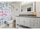 Bright bathroom featuring a modern vanity, toilet, and playful cartoon-themed shower curtain at 3967 Manson Se Ave, Smyrna, GA 30082