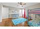 Charming bedroom with bunk beds, wood floors, and a pastel-colored dresser for storage at 3967 Manson Se Ave, Smyrna, GA 30082