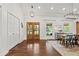 Elegant dining area features hardwood floors, modern lighting, and view to porch at 3967 Manson Se Ave, Smyrna, GA 30082