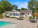 Backyard features a pool, patio, and sunroom ideal for relaxation and entertainment at 3967 Manson Se Ave, Smyrna, GA 30082