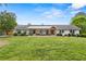 Charming, one-story home with white brick, a large, well-manicured front lawn and a welcoming front porch at 3967 Manson Se Ave, Smyrna, GA 30082
