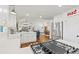 Bright kitchen featuring white cabinets, stainless steel appliances, hardwood floors, and an open floor plan at 3967 Manson Se Ave, Smyrna, GA 30082