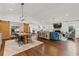 Open-concept living room with dining area, fireplace, and hardwood floors at 3967 Manson Se Ave, Smyrna, GA 30082