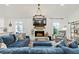 Comfortable living room with a brick fireplace and view of kitchen at 3967 Manson Se Ave, Smyrna, GA 30082