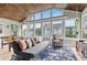 Inviting sunroom with comfortable seating, large windows, and a foosball table for entertainment at 3967 Manson Se Ave, Smyrna, GA 30082